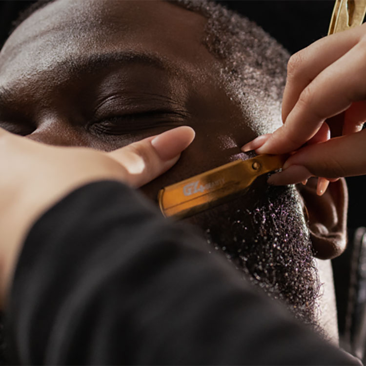 Barber lining up a clients beard