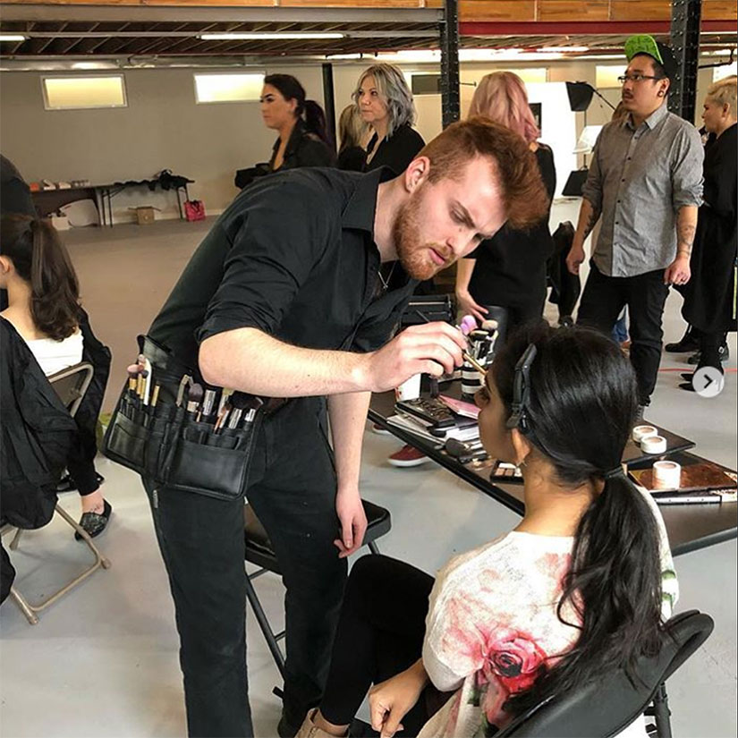 Esthetics teacher demonstrating makeup application techniques