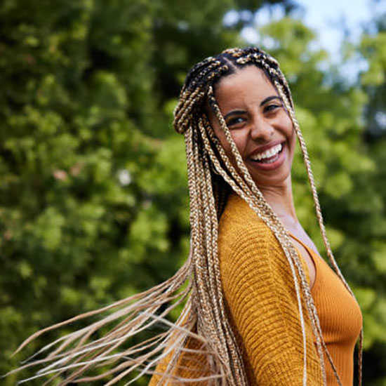 woman with long braid style from the 1970s