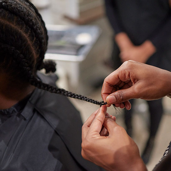 TUBC student braiding hair